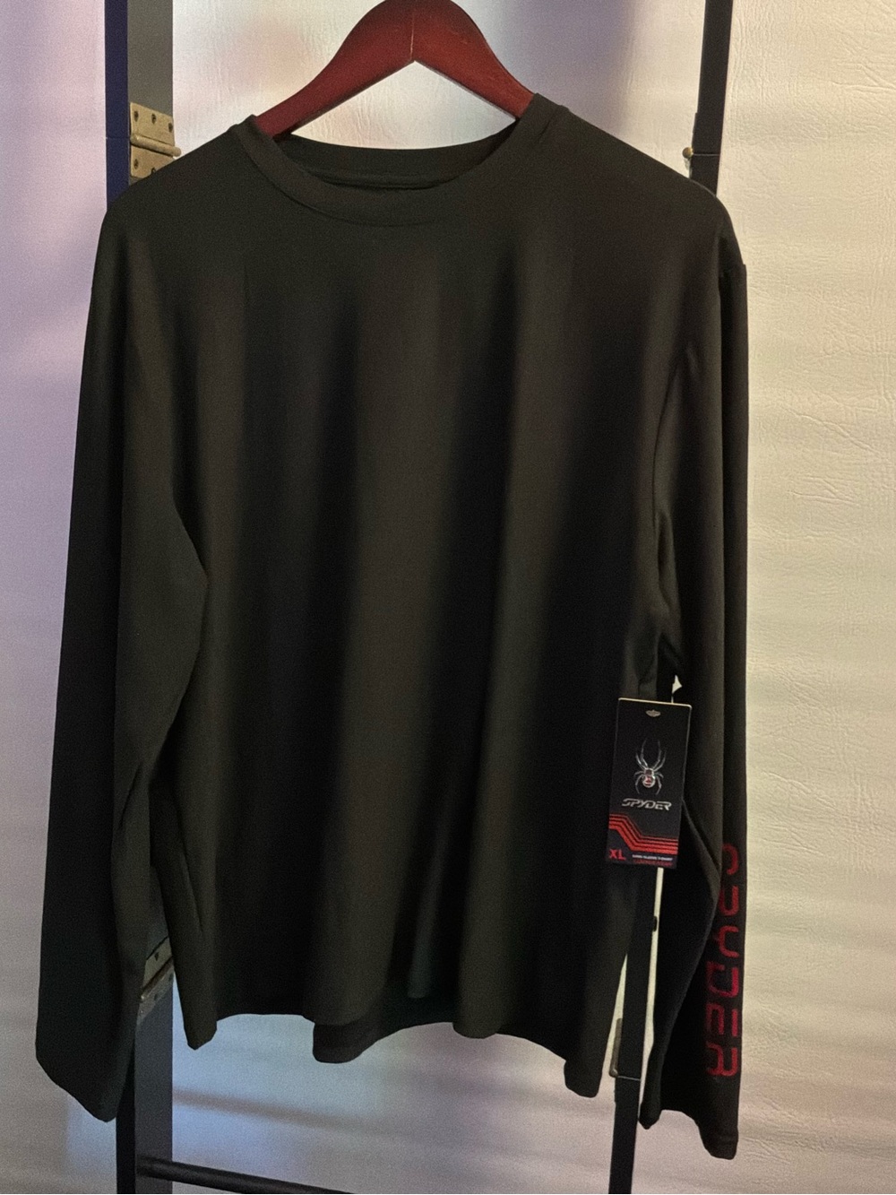 🌙✨ Spyder Men’s Black Long-Sleeve Crew Shirt with Red Sleeve Logo